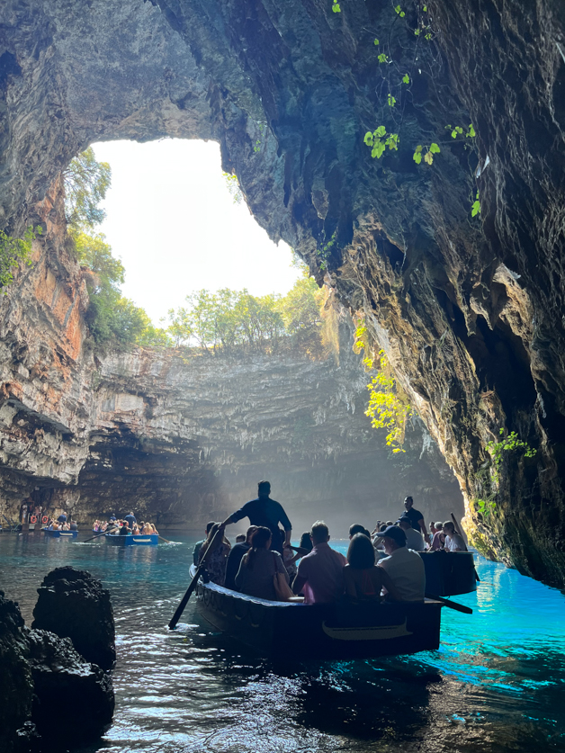 boats floating in melissani lake - top 3 of the best things to do in Kefalonia